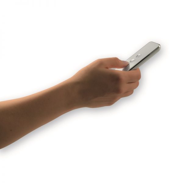 A person holding a silver remote control