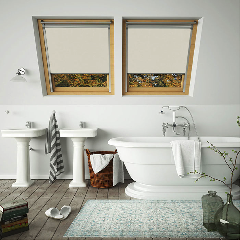 A pair of neutral skylight blinds for velux windows in a bathroom