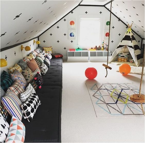 An image of a colourful and useful children's playroom in a loft converion