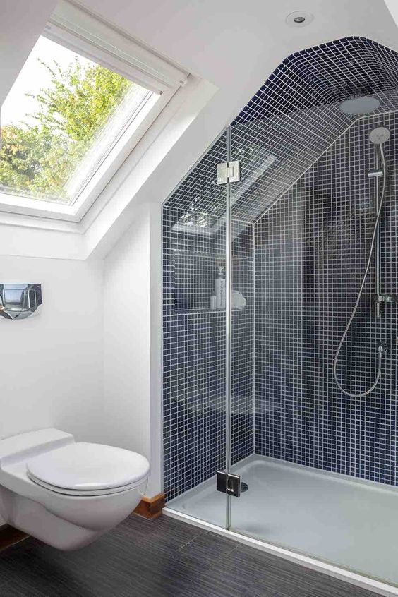 An image showing a modern and bright bathroom fitted in a loft conversion space