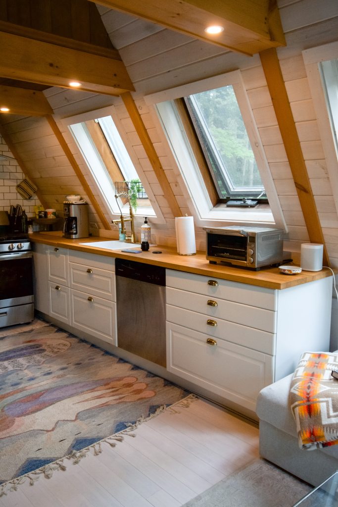 A modern kitchen showing slanted windows needing skylight blinds